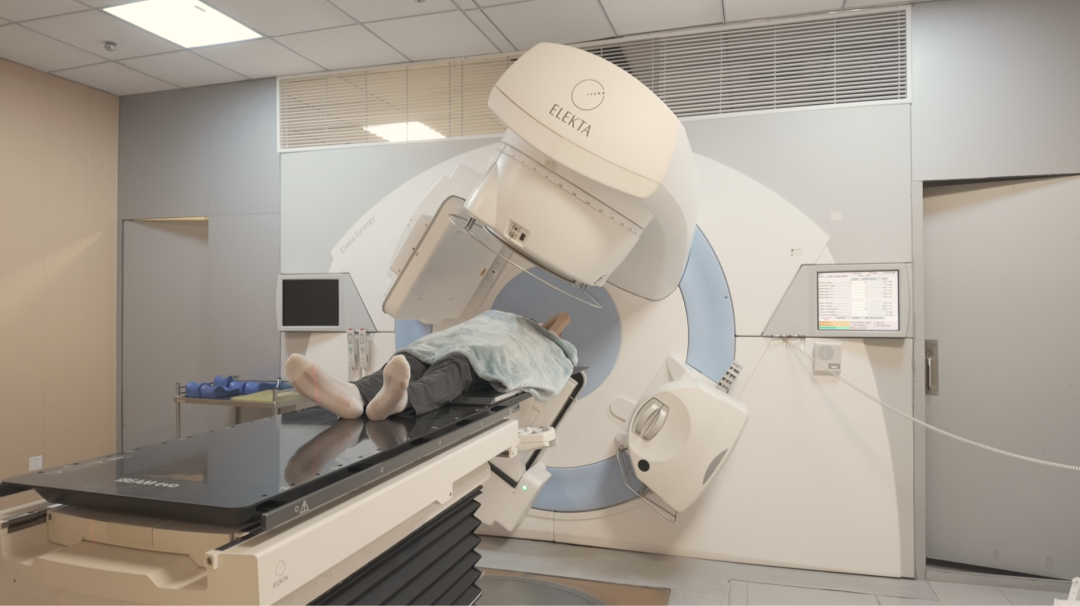 Patient receiving radiotherapy on an Elekta linear accelerator at Chongqing HYGEIA Hospital